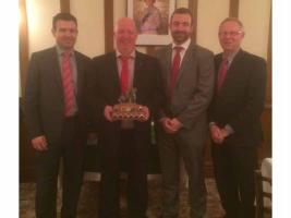 The winning team from M.J. Quinn Integrated Services, with their captain, Mike Orme, holding the trophy